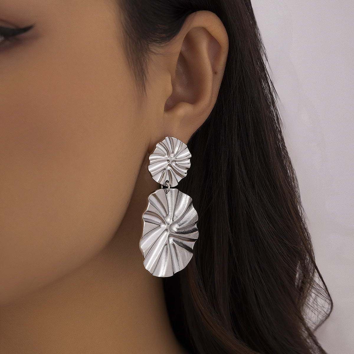 Minimalist and niche spiral patterned conch earrings