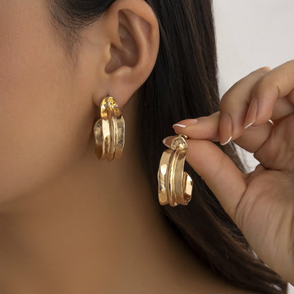Minimalist and niche spiral patterned conch earrings